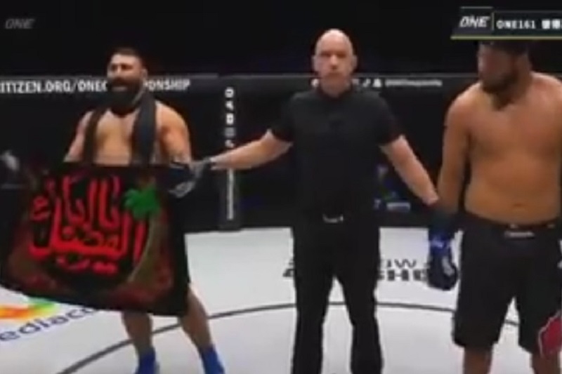 عکس| پرچم یا ابوالفضل (ع) روی دست ایرج عزیزپور قهرمان ایرانی MMA پس از پیروزی مقابل حریف برزیلی | دیلی فوتبال
